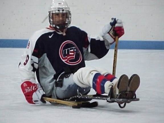Victor Calise playing sled hockey