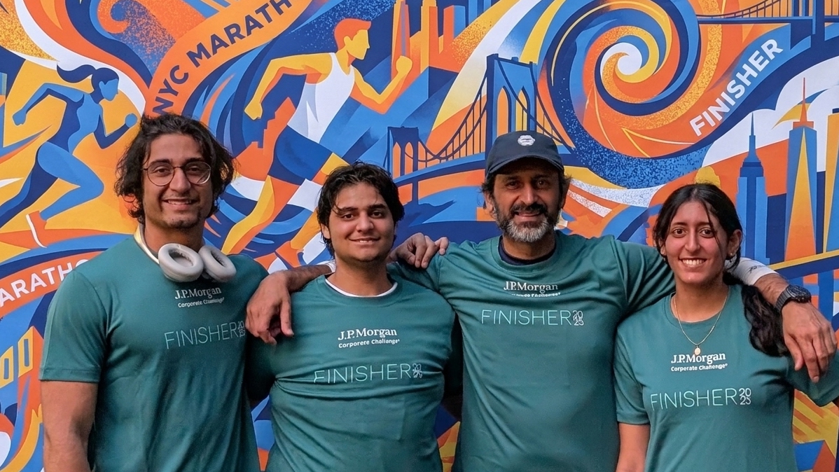 Aashni, Armaan, Anum and Kan together in front of a NYC Marathon mural